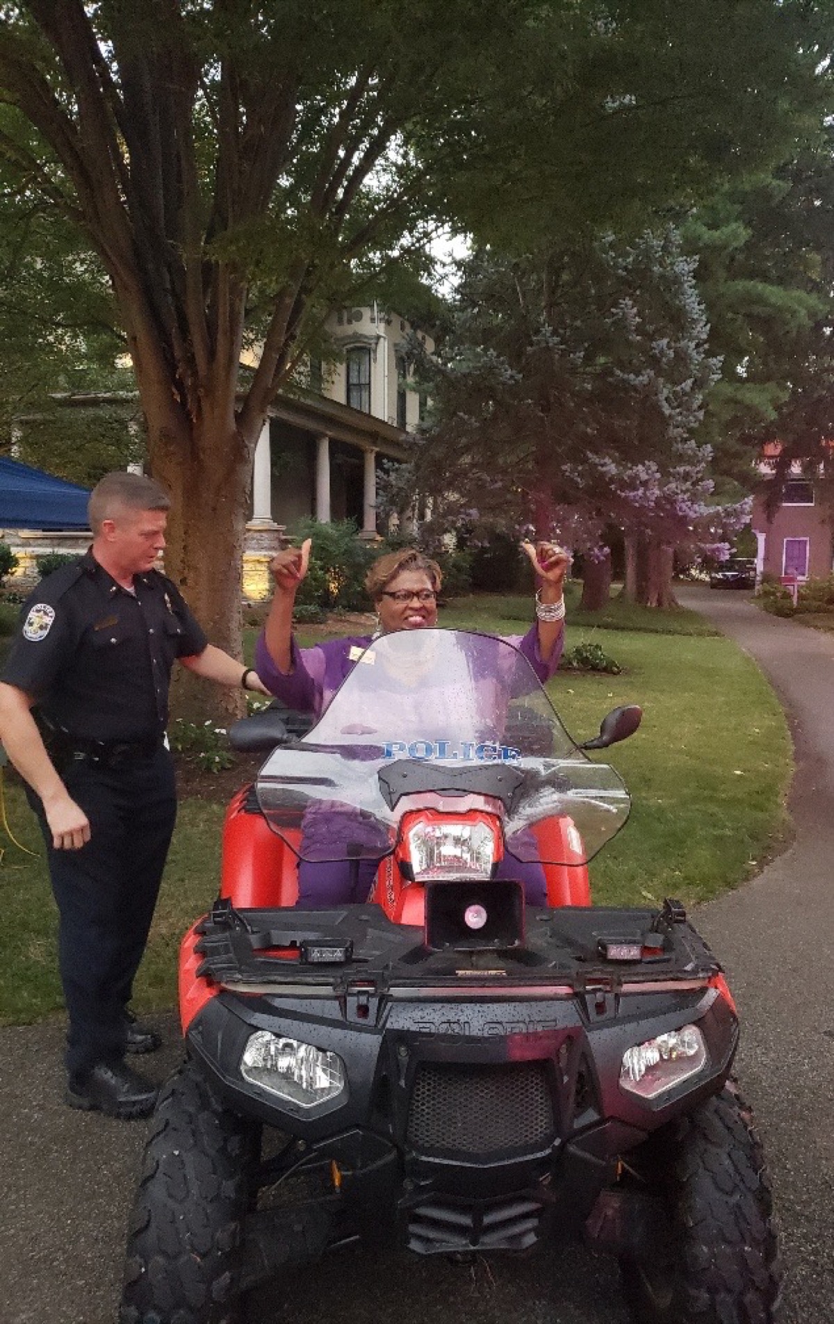 Dr. McCraney engaging with LMPD officers at a community event